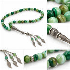 Detail collage showing banded green Agate beads, ornate silver-tone imame, spacers and three leaf charms.
