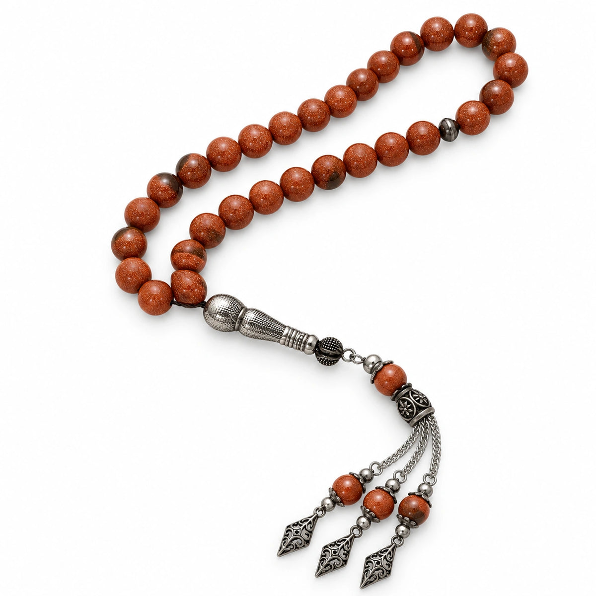 Copper-brown Goldstone tasbih with 33 beads and an ornate silver-tone three-chain tassel on a white background.