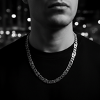Person wearing a chain necklace with a blurred background