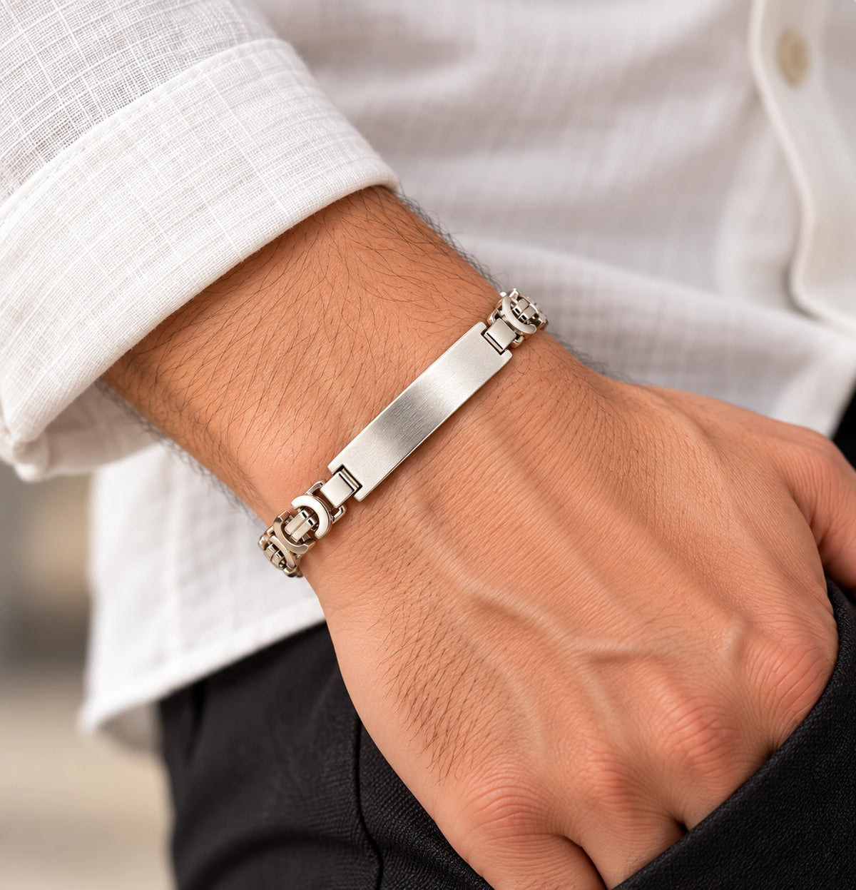 Men's 925 Italian sterling silver ID bar Byzantine bracelet worn on man's wrist with white linen shirt, lifestyle shot, Fine Silver KSA