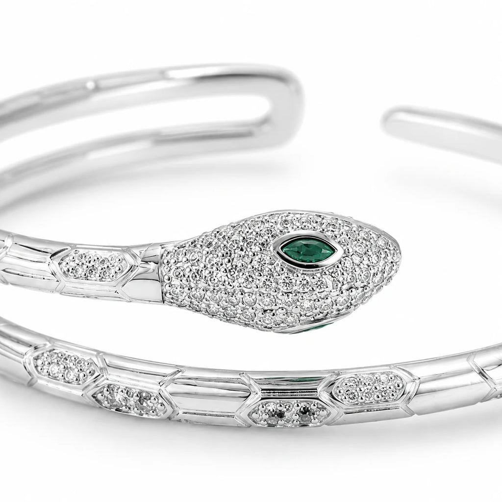 Close-up of a 925 Italian sterling silver snake cuff bracelet with marquise-cut green CZ eye, micro-pavé CZ detailing, Fine Silver KSA