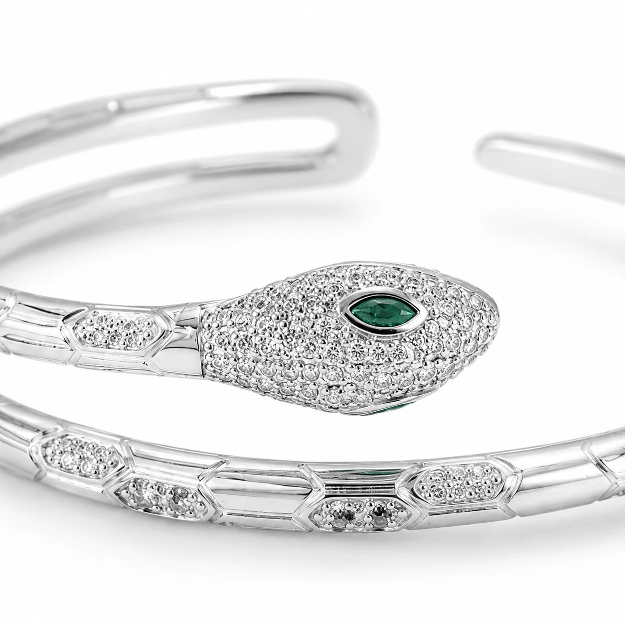 Close-up of a 925 Italian sterling silver snake cuff bracelet with marquise-cut green CZ eye, micro-pavé CZ detailing, Fine Silver KSA