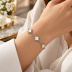 Women's 925 silver clover mother of pearl bracelet worn on wrist with white sleeve, lifestyle shot, Fine Silver KSA