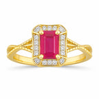 Gold ring with a pink gemstone and diamond accents on a white background