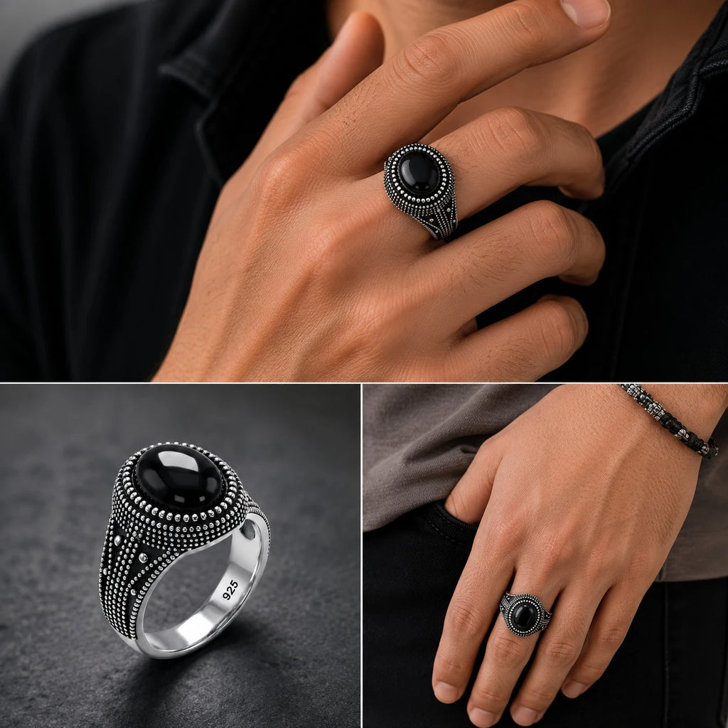 Black stone ring on a hand with close-up details on a dark background