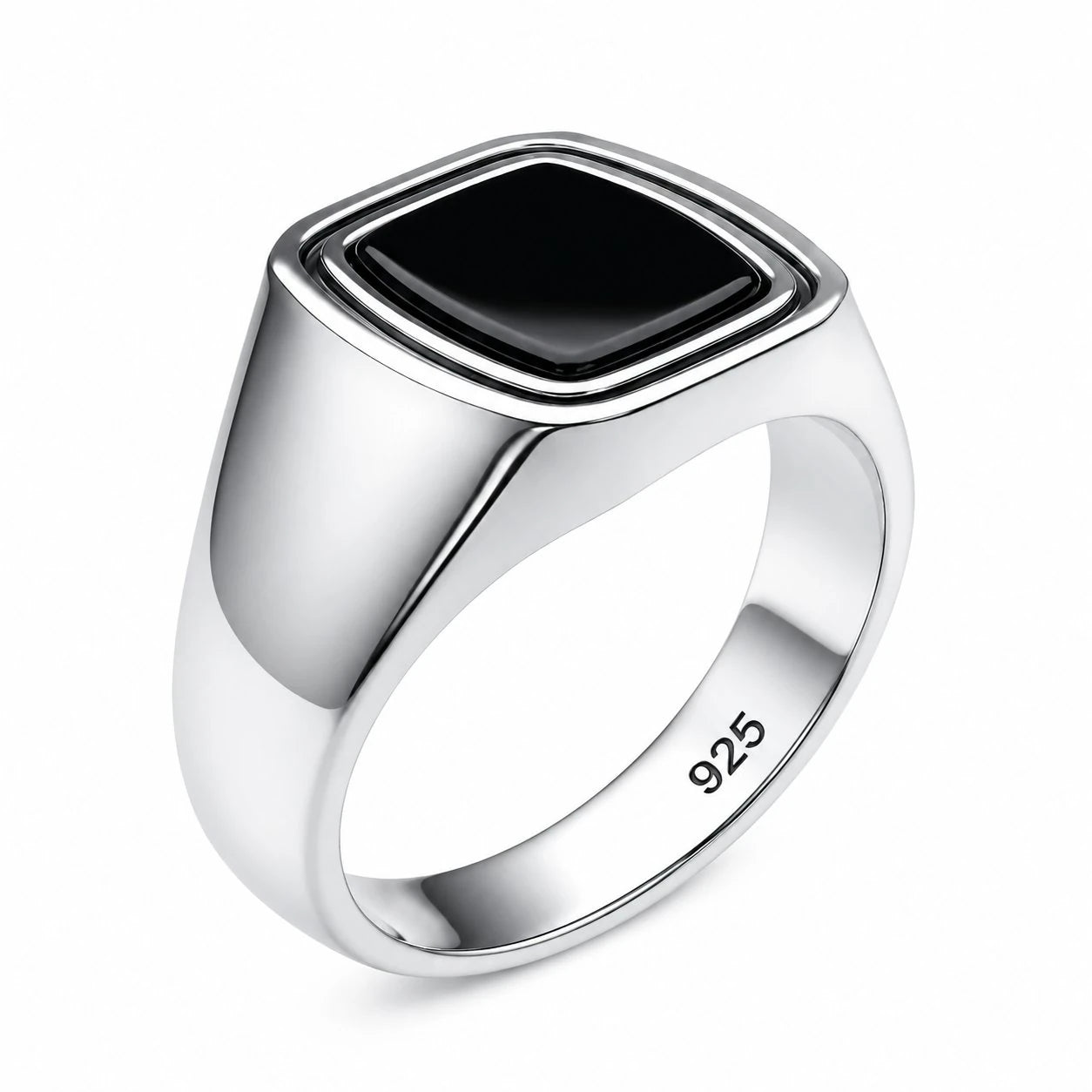 Silver ring with a black stone on a white background