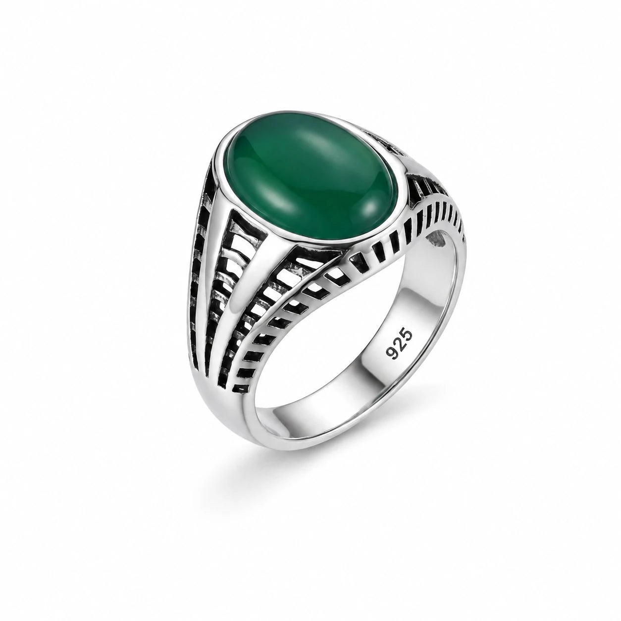 Silver ring with a green stone on a white background