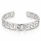 Men's polished silver open cuff bracelet with broad sculptural chain-link motifs and rounded ends on white.