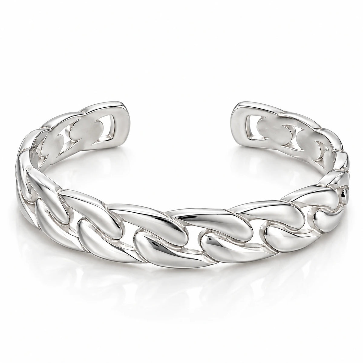 Men's polished silver open cuff bracelet with broad sculptural chain-link motifs and rounded ends on white.