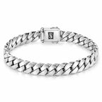 Men's polished silver Cuban-link bracelet with closely interlocking angled links and a rectangular box clasp on white.