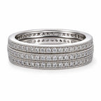 Set of three diamond-studded rings on a white background
