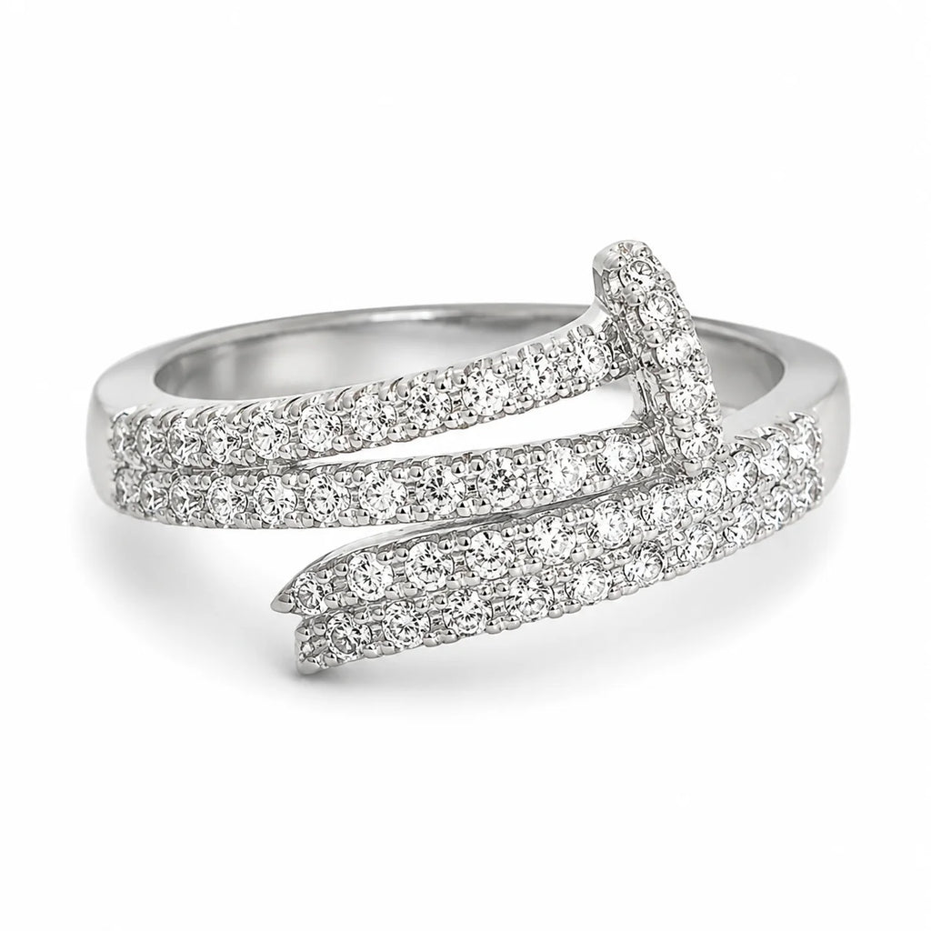 Silver ring with diamond accents on a white background