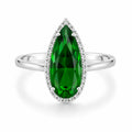 Silver ring with a large green gemstone on a white background