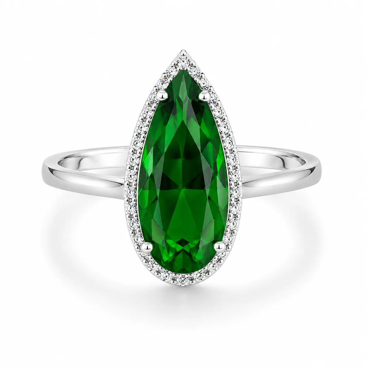 Silver ring with a large green gemstone on a white background