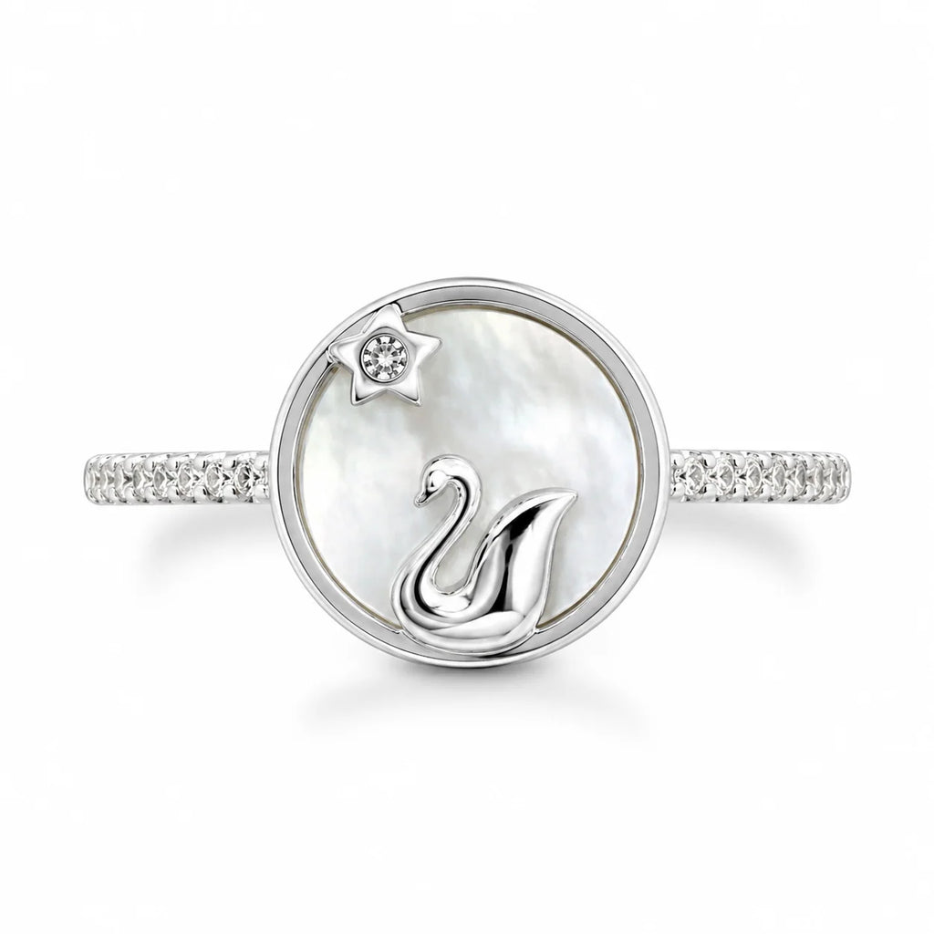 Silver ring with a swan design on a white background