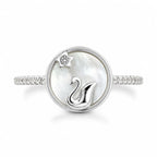 Silver ring with a swan design on a white background