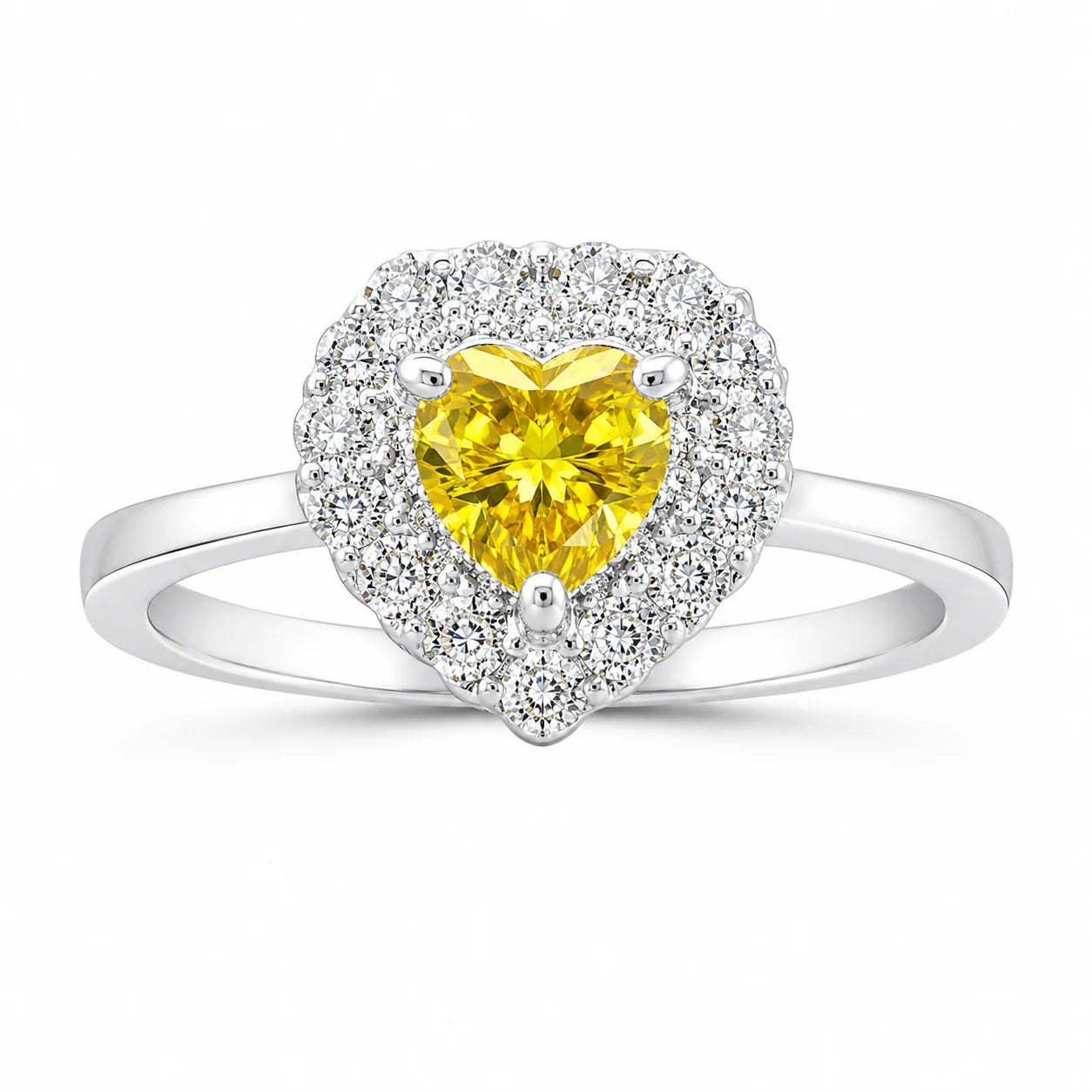 Heart-shaped ring with a yellow gemstone and diamond accents on a white background