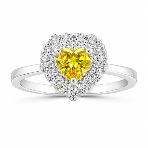 Heart-shaped ring with a yellow gemstone and diamond accents on a white background