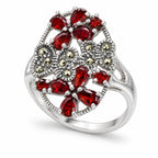 Women's 925 silver red CZ marcasite floral ring, angle view showing openwork oval frame and double flower clusters, Fine Silver KSA