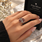 Women's 925 silver red CZ floral marcasite ring worn on woman's finger beside Fine Silver gift box, lifestyle shot, KSA